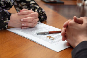 Couple Signing Divorce Papers with Attorney