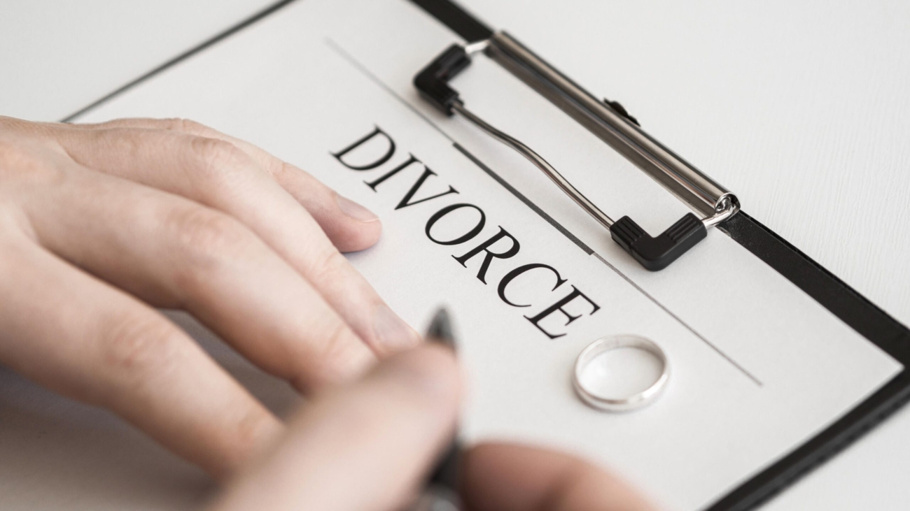 close-up-male-signing-divorce-contract